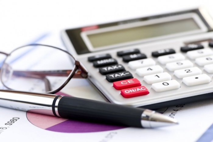 photodune_195756_tax_calculator_pen_and_glasses_s1-660x438